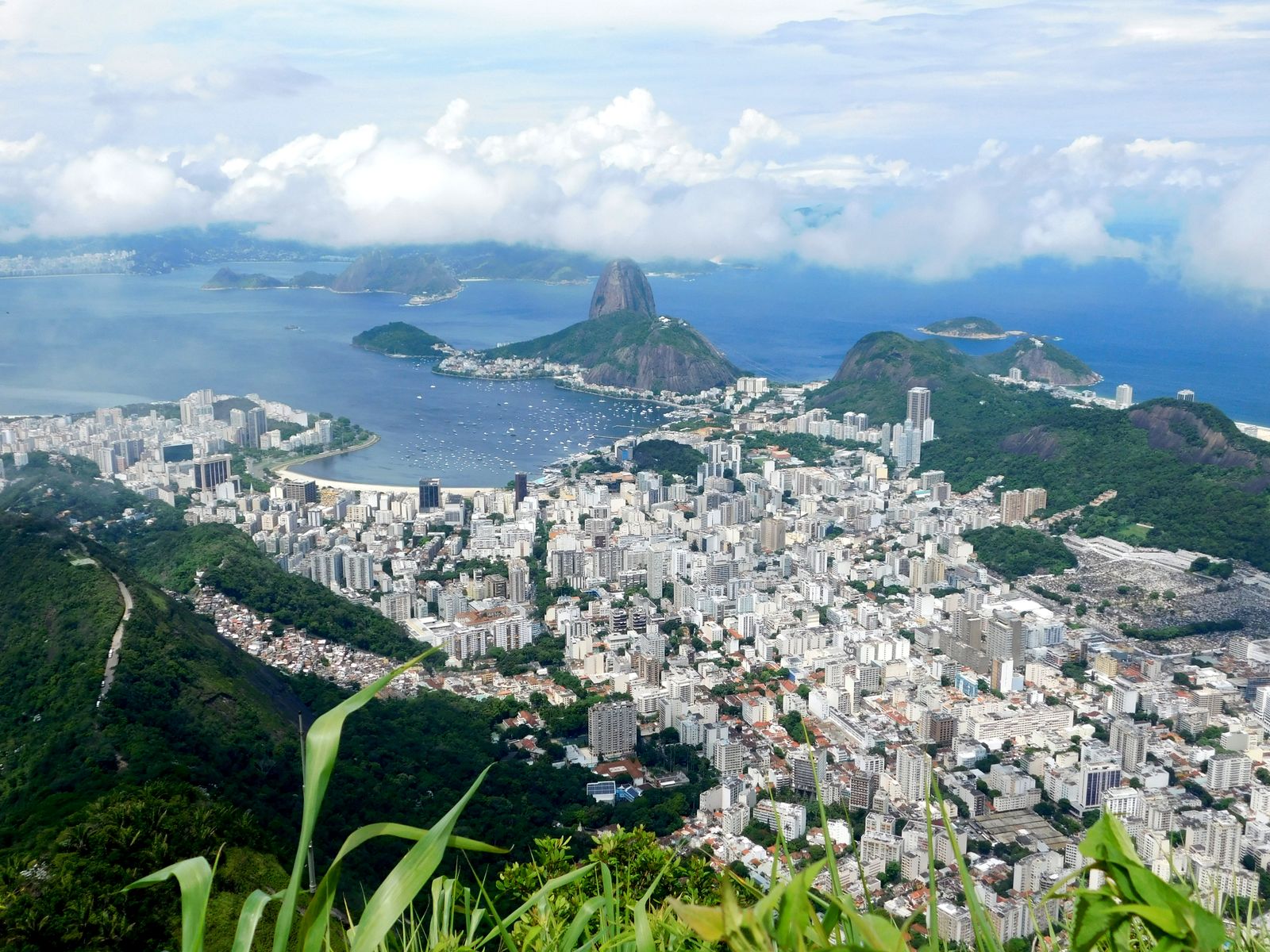 Breathtaking aerial view of Rio de Janeiro, highlighting Sugarloaf Mountain and lush landscapes.